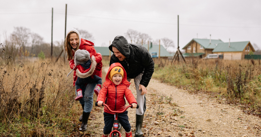 parents playing and laughing with children